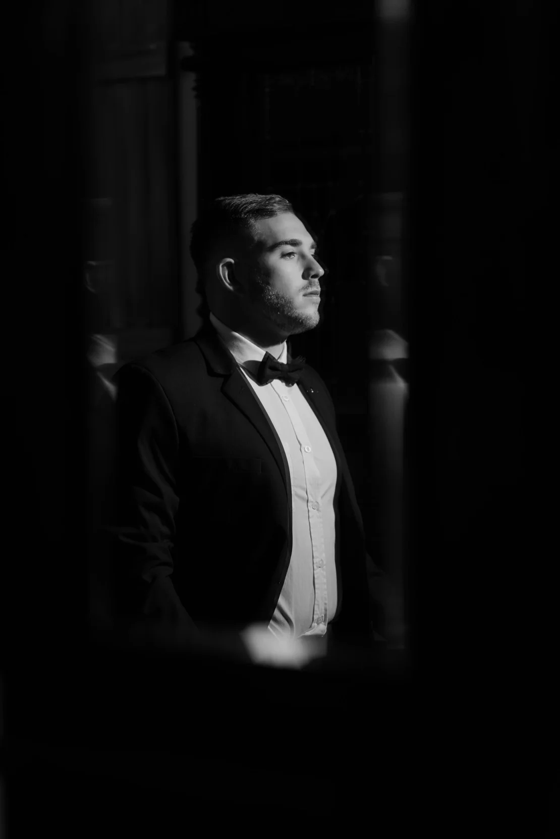 Groom silhouetted in a doorway before the ceremony, Pretoria wedding