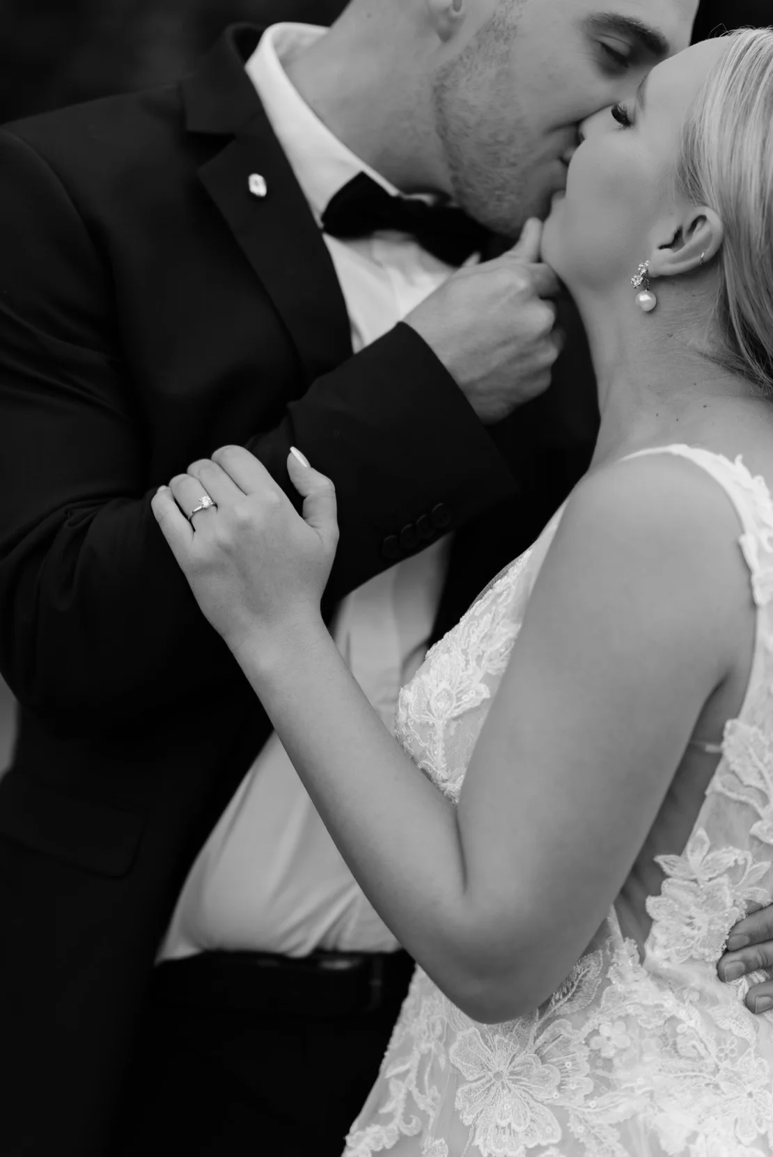 Bride and groom sharing a passionate kiss in black and white, Pretoria wedding